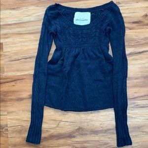 Babydoll sweater with cable knit detail